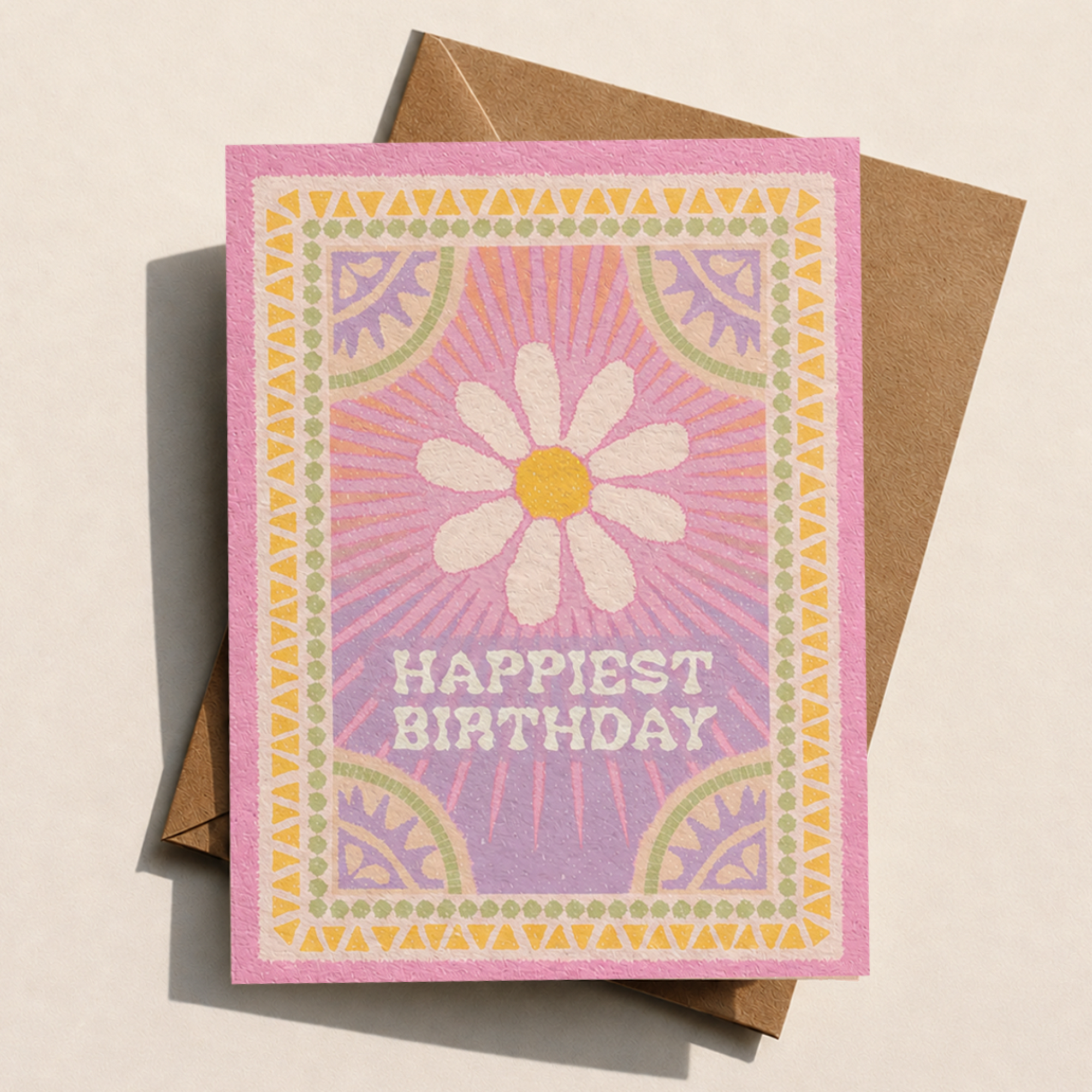 Birthday card with a daisy design and 'Happiest Birthday' text on a pink background.