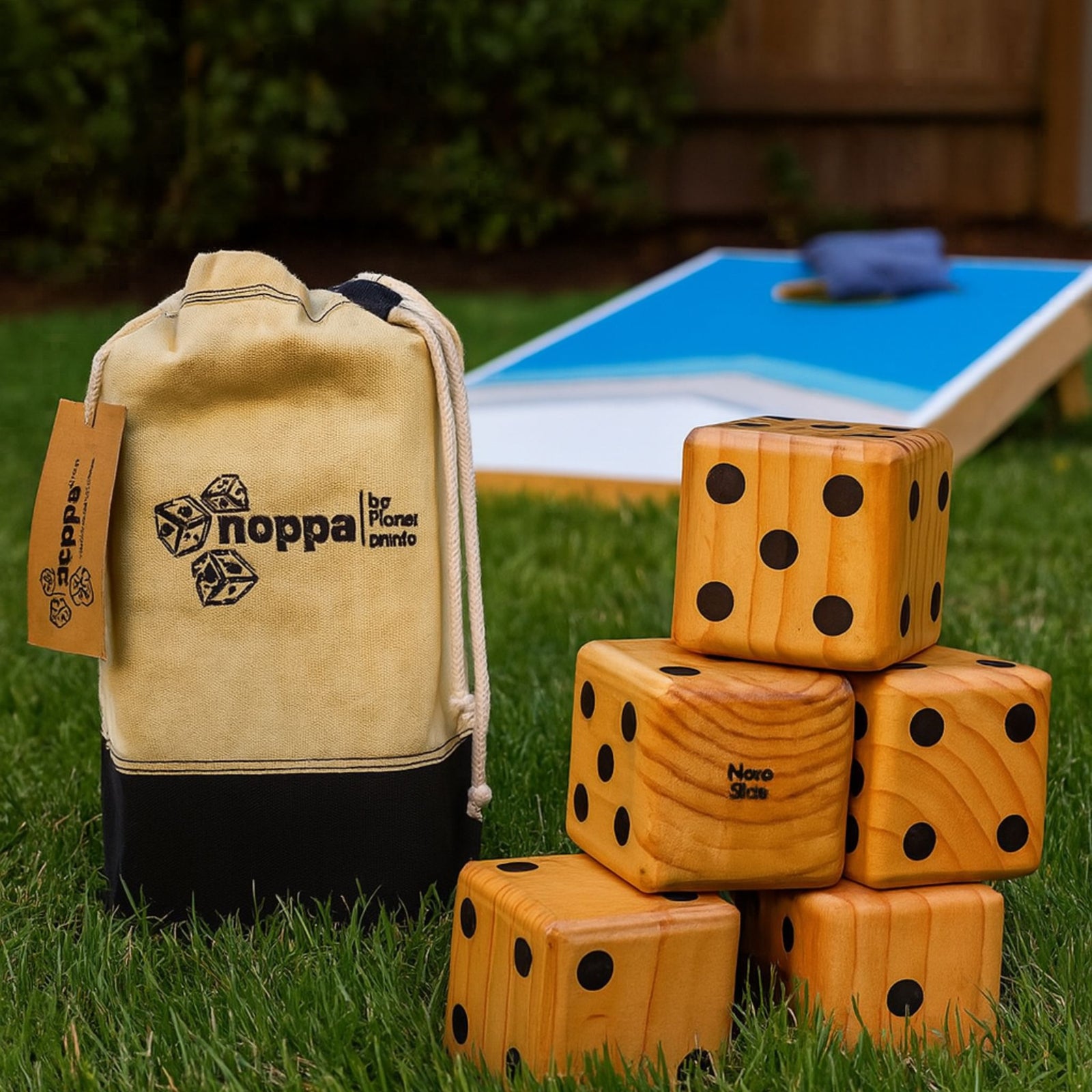 Wooden dice set with a drawstring bag on a white background