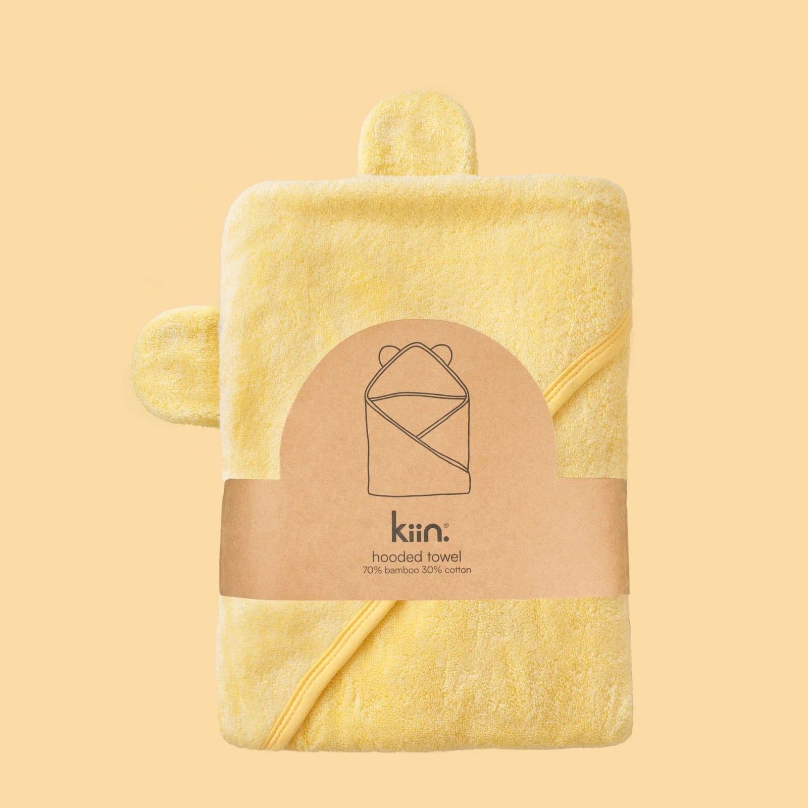 A green hooded towel with bamboo fabric designed for babies, displayed against a neutral background.