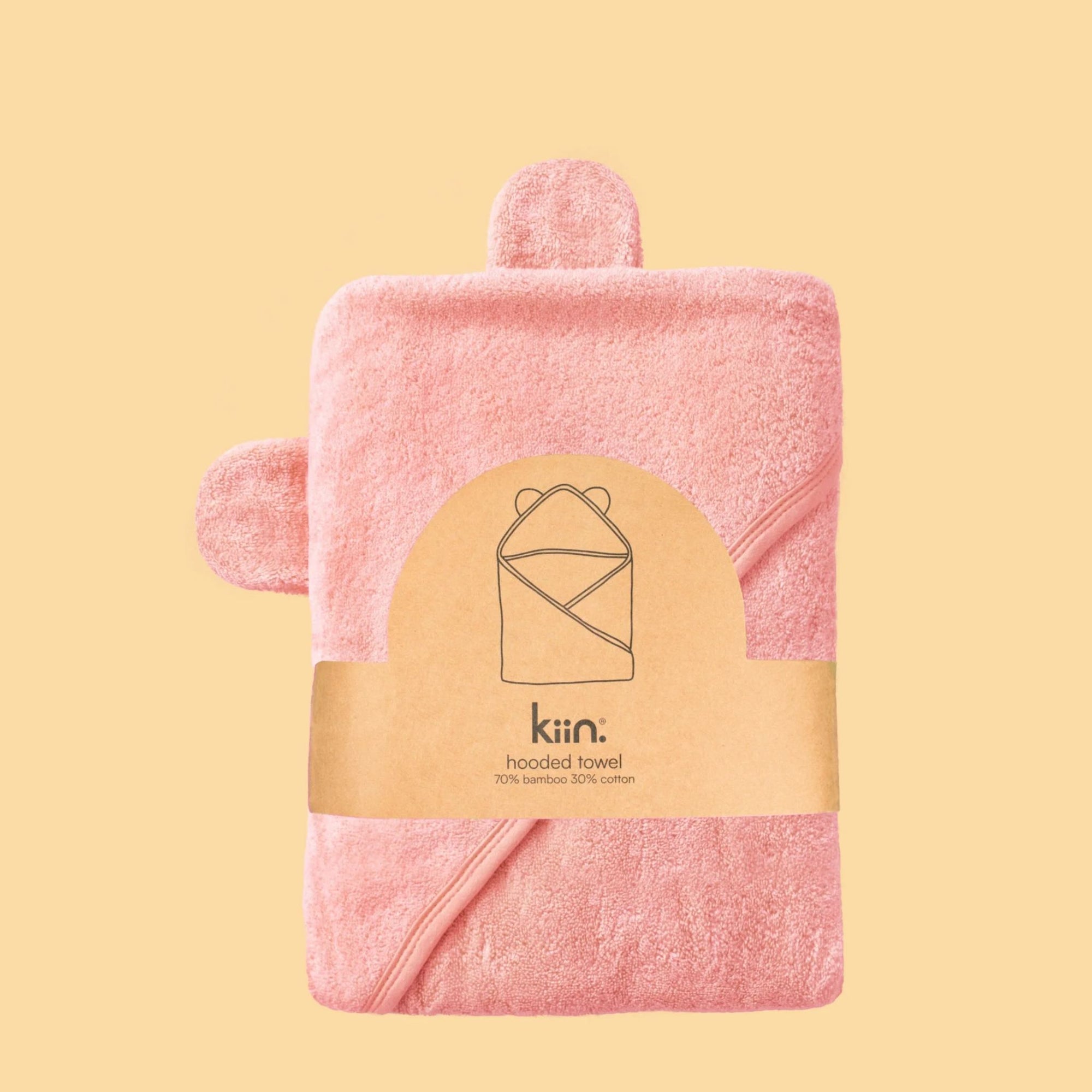 A pink hooded towel with bamboo fabric designed for babies, displayed against a neutral background.