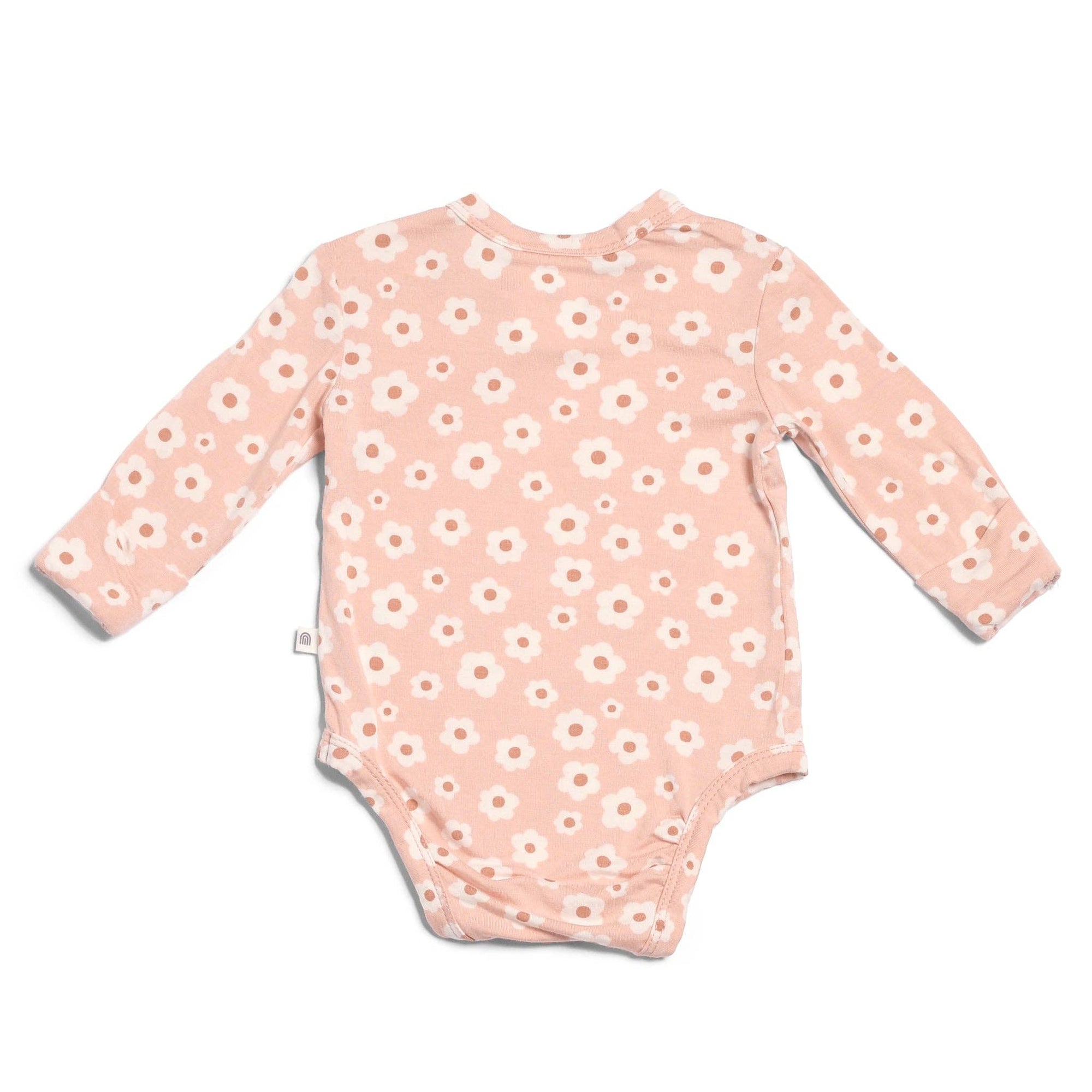 Pink baby onesie with white floral pattern on a white background