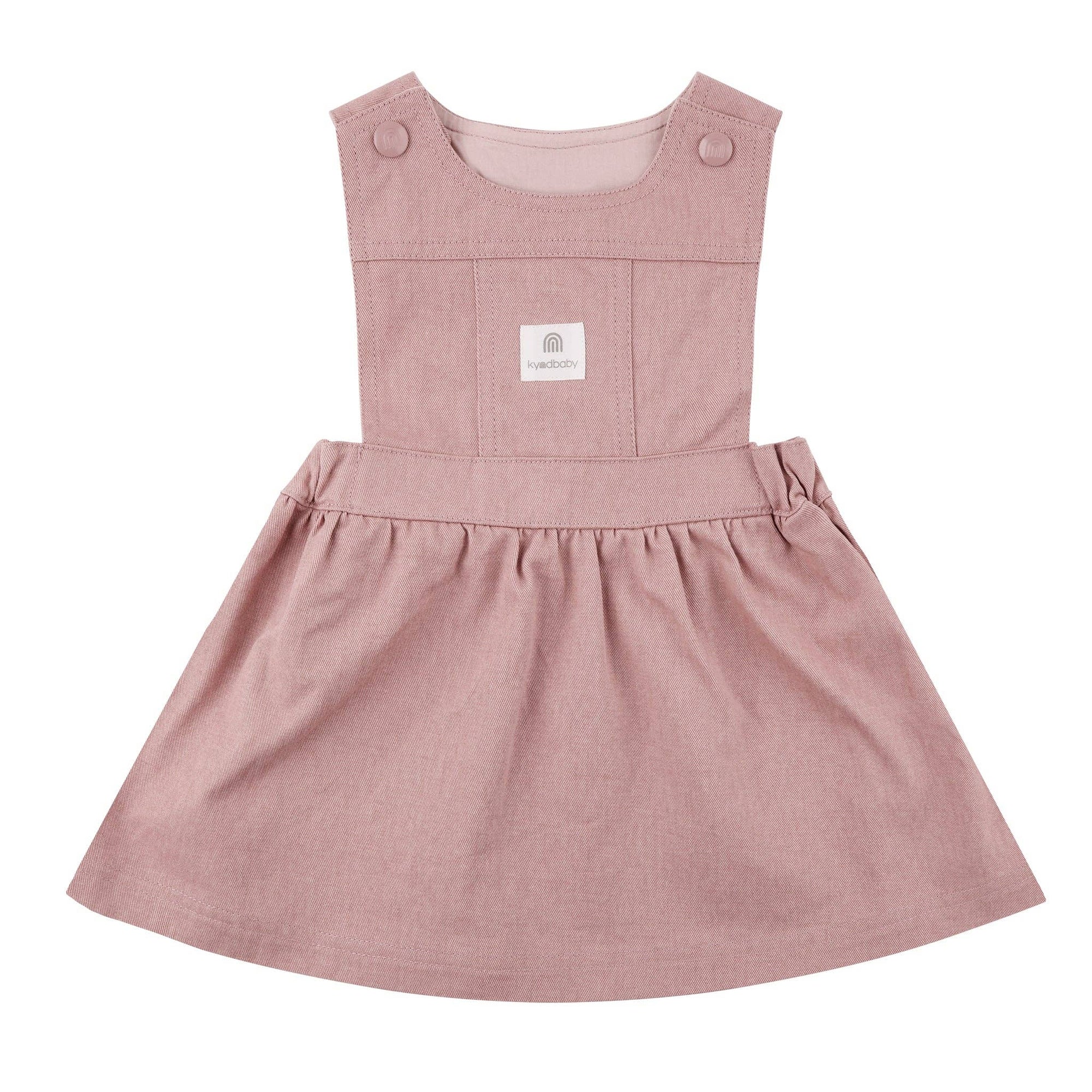 Pink children&#39;s dress with a brand label on a white background