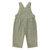 Green corduroy overalls on a white background
