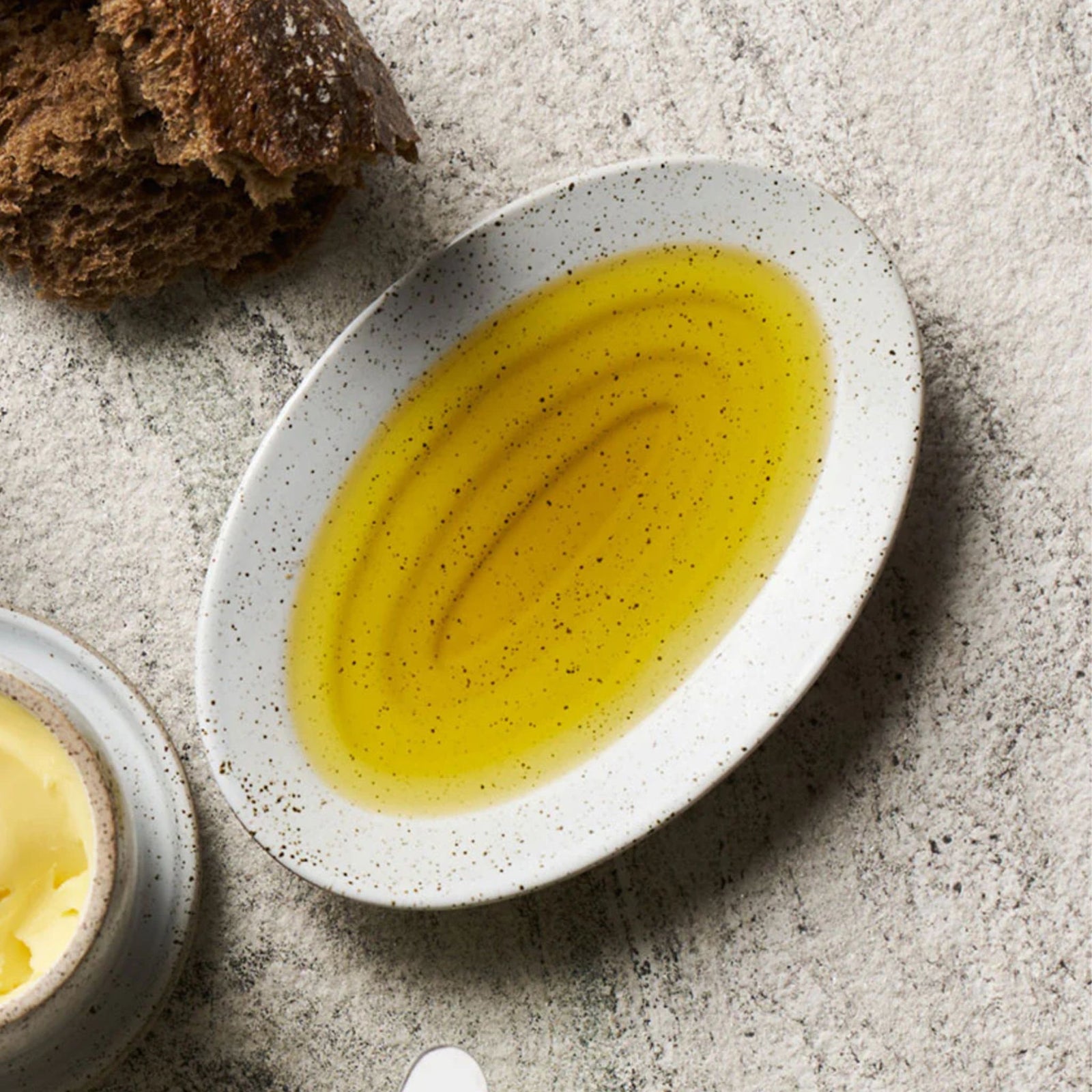 Speckled ceramic plate on a white background