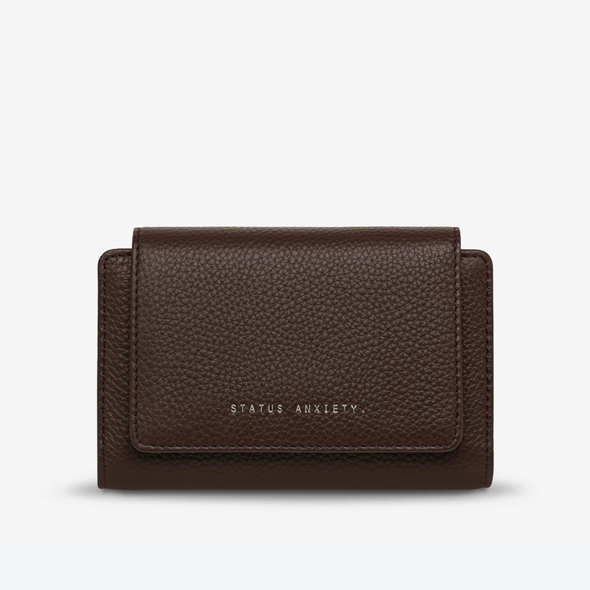 Brown wallet with &#39;STATUS ANXIETY&#39; branding on a white background